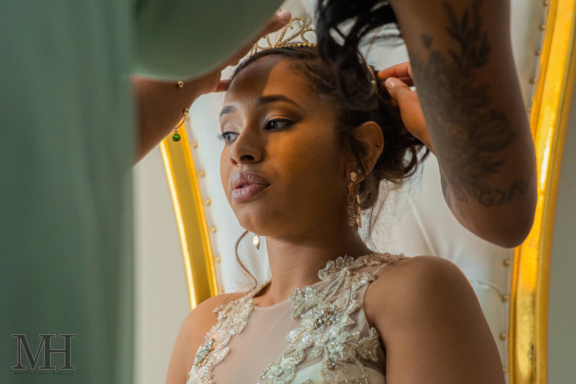 Bride having her crown and hair set before the ceremony