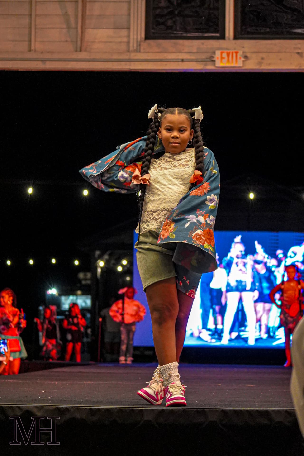 Young model walking the runway at a fashion show
