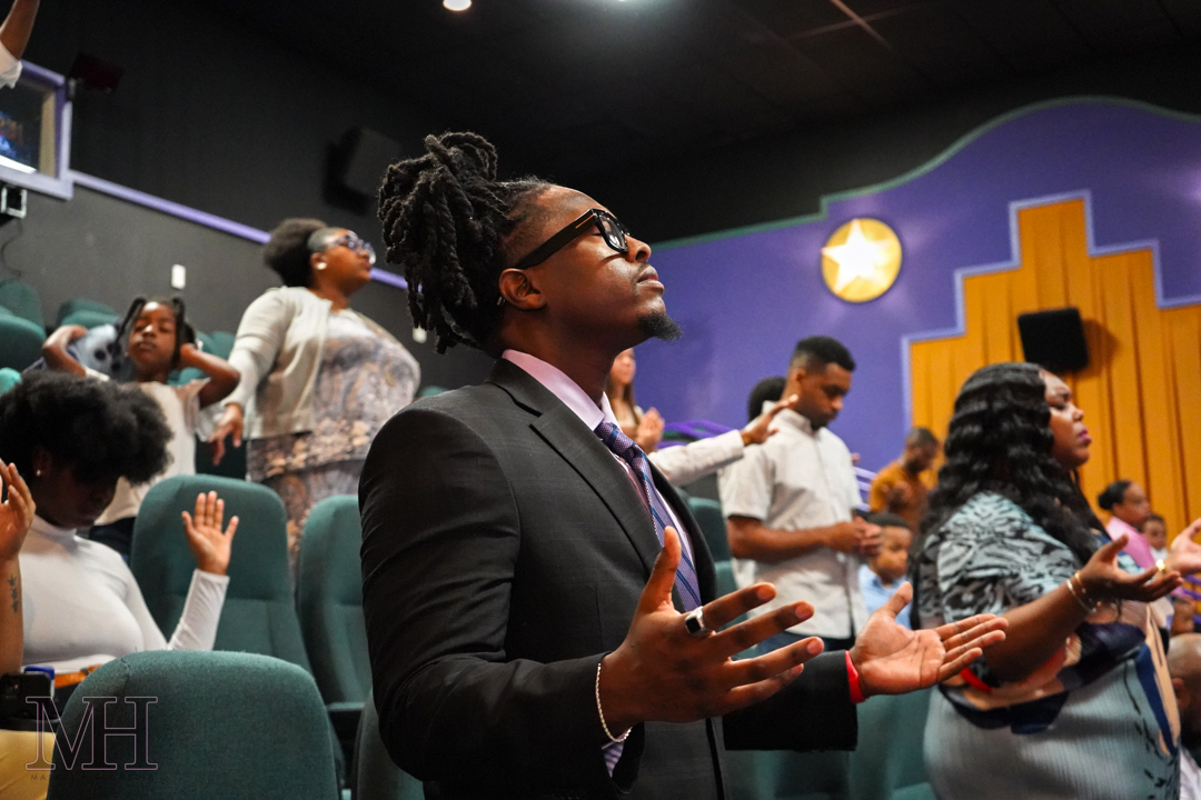 Congregation worshipping during a church service