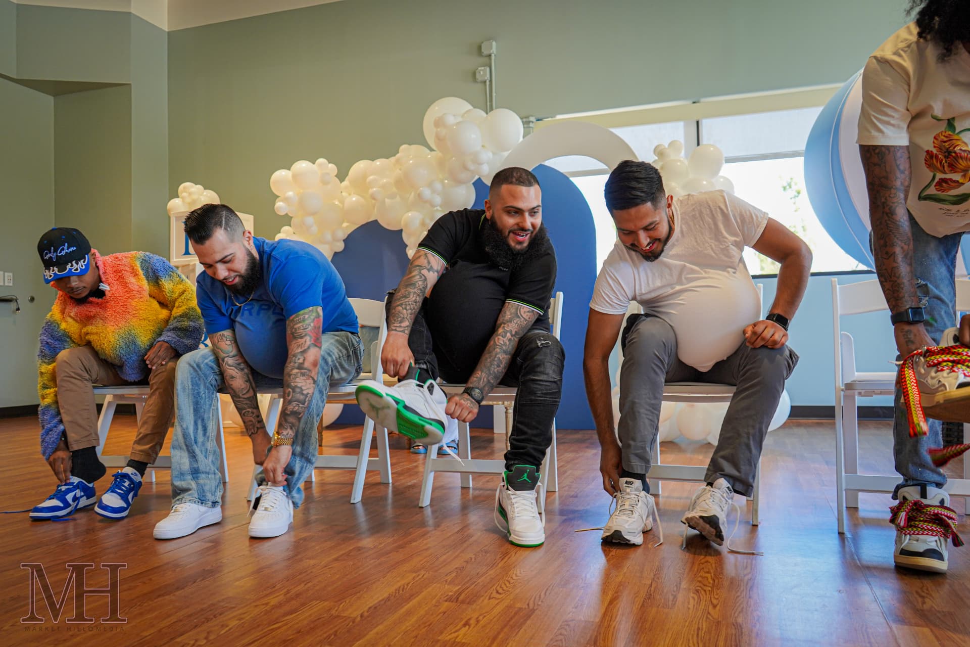 Guests laughing during a baby shower game