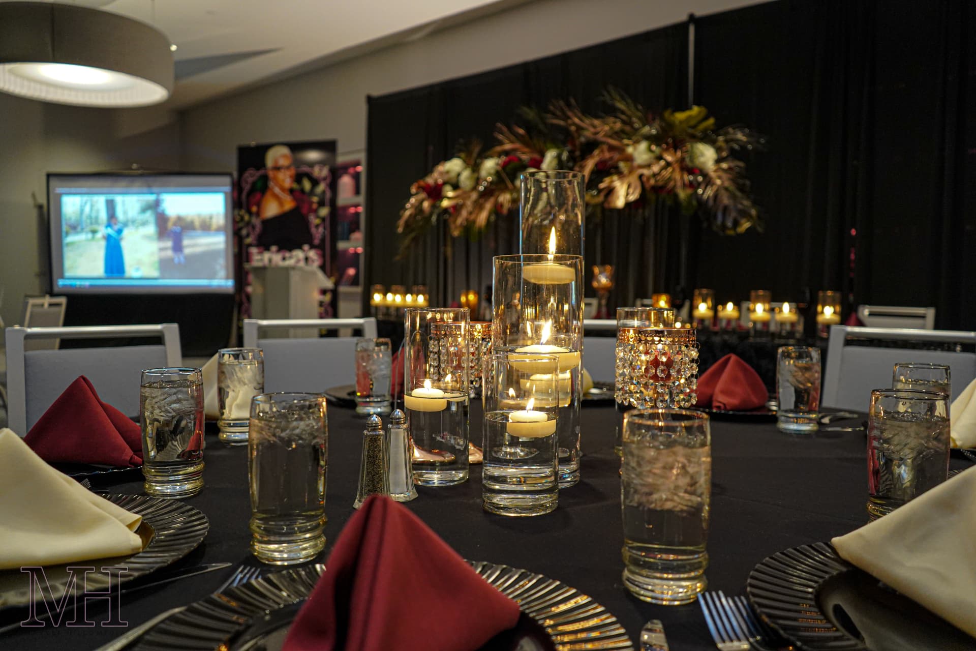 Candlelit banquet table setting at a formal gala
